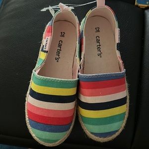 Girls Size 12 Carter’s slip n canvas shoes with adorable colors.